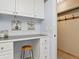 Laundry room with desk, storage, and a walk-in closet, perfect for home organization at 2225 Linda Vista Dr, Lakewood, CO 80215