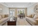 Spacious living room featuring neutral tones and comfortable furniture, perfect for relaxation and gatherings at 2225 Linda Vista Dr, Lakewood, CO 80215