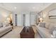 Bright living room featuring neutral tones, recessed lighting, and plenty of storage space with large closets at 2225 Linda Vista Dr, Lakewood, CO 80215