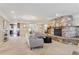 Inviting living room featuring a beautiful stone fireplace and neutral decor at 2225 Linda Vista Dr, Lakewood, CO 80215