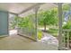 Covered porch offering a serene view of the landscaped front yard and neighborhood at 2225 Linda Vista Dr, Lakewood, CO 80215