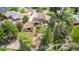 Aerial view of a charming home with a lush yard and mature trees at 6975 S Chase Ct, Littleton, CO 80128