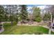 Private backyard oasis with mature trees and meticulous landscaping at 6975 S Chase Ct, Littleton, CO 80128