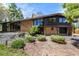 Attractive front entrance showcasing a brick facade, modern landscaping, and a welcoming doorway at 6975 S Chase Ct, Littleton, CO 80128