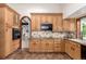 Kitchen with custom cabinetry, granite countertops, and stainless steel appliances at 6975 S Chase Ct, Littleton, CO 80128