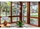 Bright living room showcasing large windows and modern hanging lights at 6975 S Chase Ct, Littleton, CO 80128