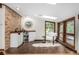 Bright room with corner windows, a skylight, and a cozy seating area at 6975 S Chase Ct, Littleton, CO 80128