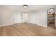 Main bedroom with two closets leads to a connected bathroom with tile floors at 6975 S Chase Ct, Littleton, CO 80128
