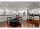 Spacious finished basement gallery with hardwood floors and gallery-style track lighting at 1700 E Tufts Ave, Cherry Hills Village, CO 80113
