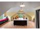 Spacious bonus room featuring a window seat, two desks, and a cork floor at 1700 E Tufts Ave, Cherry Hills Village, CO 80113