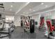 Home gym with various exercise equipment, including a treadmill, stationary bike, and weight machines at 1700 E Tufts Ave, Cherry Hills Village, CO 80113