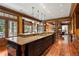 Large kitchen island with granite countertops, custom cabinets, and stainless steel sink at 1700 E Tufts Ave, Cherry Hills Village, CO 80113