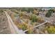 Picturesque aerial view showcasing lush greenery, a winding river, and a peaceful walking trail at 5058 E Cherry Creek South Dr, Denver, CO 80246