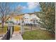 Charming backyard with black iron fence, a lush lawn, and a cozy patio area for outdoor entertaining at 5058 E Cherry Creek South Dr, Denver, CO 80246