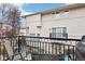 Relaxing balcony featuring sleek metal railing and comfortable seating with neighborhood views at 5058 E Cherry Creek South Dr, Denver, CO 80246