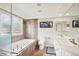 Bright primary bath with a glass enclosed shower, tub, and double sinks at 5058 E Cherry Creek South Dr, Denver, CO 80246