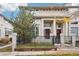 Elegant home featuring manicured landscaping, a black iron fence, and a welcoming front entrance at 5058 E Cherry Creek South Dr, Denver, CO 80246