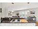 Stylish kitchen with breakfast bar, granite countertops, and ample counter space at 5058 E Cherry Creek South Dr, Denver, CO 80246