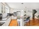 Kitchen with breakfast bar, stainless steel appliances, and bright, inviting layout at 5058 E Cherry Creek South Dr, Denver, CO 80246