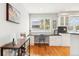 Bright office space with hardwood floors and a window overlooking the neighborhood at 5058 E Cherry Creek South Dr, Denver, CO 80246