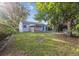 Large backyard with mature trees and a well-maintained lawn at 2105 S Irving St, Denver, CO 80219