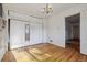 Functional bedroom with hardwood floors, closet, and ample storage space at 2105 S Irving St, Denver, CO 80219