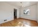 Bedroom showcasing hardwood floors, natural light, and a view of the neighborhood at 2105 S Irving St, Denver, CO 80219