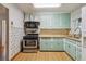 Well-equipped kitchen boasting ample cabinetry and space for cooking and storage at 2105 S Irving St, Denver, CO 80219