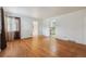 Bright living room boasts gleaming hardwood floors and natural light from a window at 2105 S Irving St, Denver, CO 80219