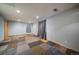 Finished basement with patterned carpet tiles, recessed lighting, and ample space for flexible use at 11539 Depew Ct, Westminster, CO 80020