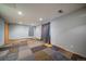 Finished basement with patterned carpet tiles, recessed lighting, and ample space for flexible use at 11539 Depew Ct, Westminster, CO 80020