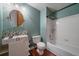 Bathroom featuring stylish stone backsplash and modern vanity with a shower and bathtub combo at 11539 Depew Ct, Westminster, CO 80020