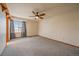 Bright bedroom with large window, neutral walls, and a ceiling fan to keep you comfortable all year long at 11539 Depew Ct, Westminster, CO 80020