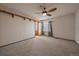 Cozy bedroom featuring a ceiling fan and an entrance into a bathroom, ensuring convenience and comfort at 11539 Depew Ct, Westminster, CO 80020