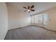 Bright carpeted bedroom with a ceiling fan and large bay window at 11539 Depew Ct, Westminster, CO 80020