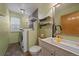 Practical laundry room including washer, dryer, sink, and storage shelves for added convenience at 11539 Depew Ct, Westminster, CO 80020