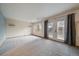 Spacious living room featuring a window and glass patio doors for bright natural light and easy outdoor access at 11539 Depew Ct, Westminster, CO 80020