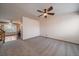 Carpeted Living room with a fan and stairs at 11539 Depew Ct, Westminster, CO 80020