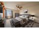 Serene main bedroom with a plush bed, decorative accents, and a large window at 11539 Depew Ct, Westminster, CO 80020