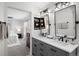 Contemporary bathroom featuring double vanity, black fixtures, and modern vanity at 2393 Yosemite St, Denver, CO 80238