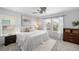 Bright and airy bedroom with neutral decor, ceiling fan, and plush carpeting at 2393 Yosemite St, Denver, CO 80238