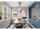 Dining room with natural light, open to living space, features modern artwork and lighting at 2393 Yosemite St, Denver, CO 80238