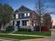 Charming two-story home with a covered front porch and manicured lawn in a quiet neighborhood at 2393 Yosemite St, Denver, CO 80238