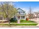 Charming two-story home featuring a welcoming front porch, well-maintained lawn, and beautiful curb appeal at 2393 Yosemite St, Denver, CO 80238
