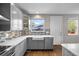 Bright kitchen featuring stainless steel appliances, white countertops, and modern backsplash at 2393 Yosemite St, Denver, CO 80238