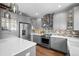 Stylish kitchen with stainless steel appliances, quartz countertops, and ample cabinet storage at 2393 Yosemite St, Denver, CO 80238