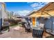Charming patio perfect for relaxing, with stylish patio furniture and umbrellas for shade and comfort at 2393 Yosemite St, Denver, CO 80238