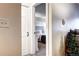 View into bedroom with gray headboard, white bedding, gray accents, and a sitting area at 10150 E Virginia Ave # 19-102, Denver, CO 80247