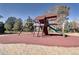 Community playground with a wood playset, slide, and swingset on a mulch base at 10150 E Virginia Ave # 19-102, Denver, CO 80247