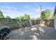 Gravel-covered backyard featuring a mix of chain link and wood fencing, offering privacy and functionality at 4456 S Washington St, Englewood, CO 80113